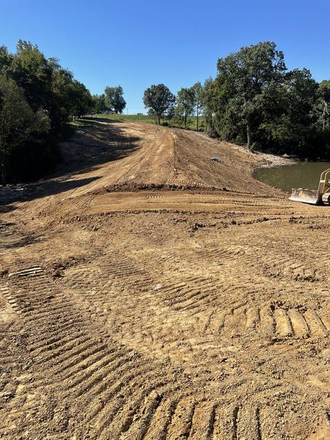 Earthen dam and terrace grading