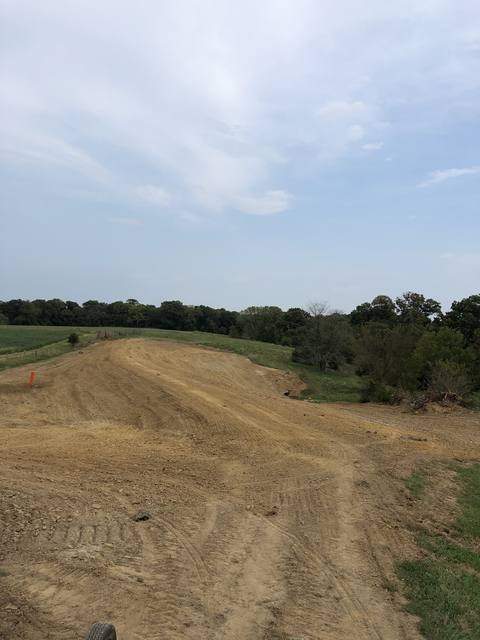 Graded slope shaped for drainage
