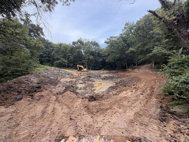 Wide view of pond excavation in progress