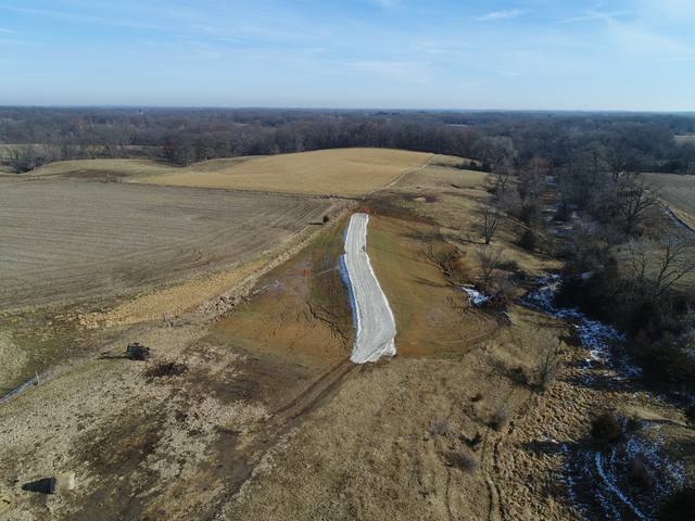 Wide aerial view of a completed waterway across farm fields